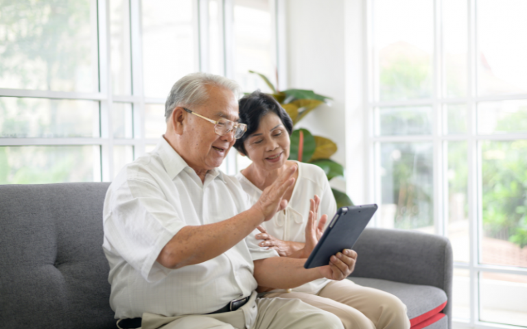 Seniors playing on a tablet